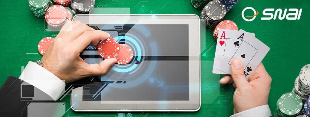Un tavolo da poker, un tablet e il logo SNAI