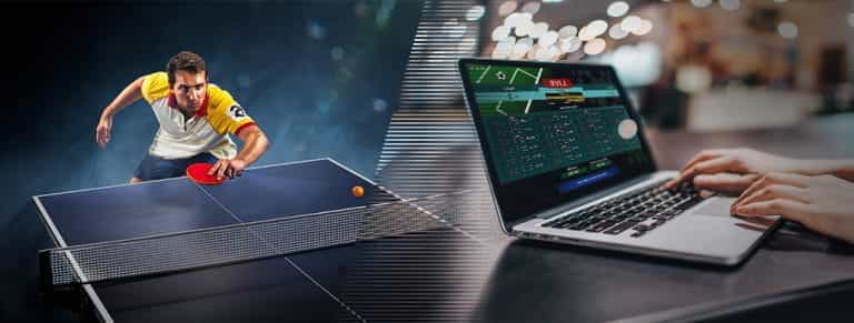 Un giocatore di tennistavolo e un computer collegato ad un sito di scommesse