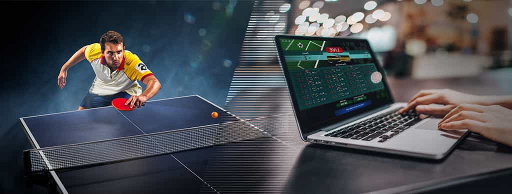 Un giocatore di tennistavolo e un computer collegato ad un sito di scommesse