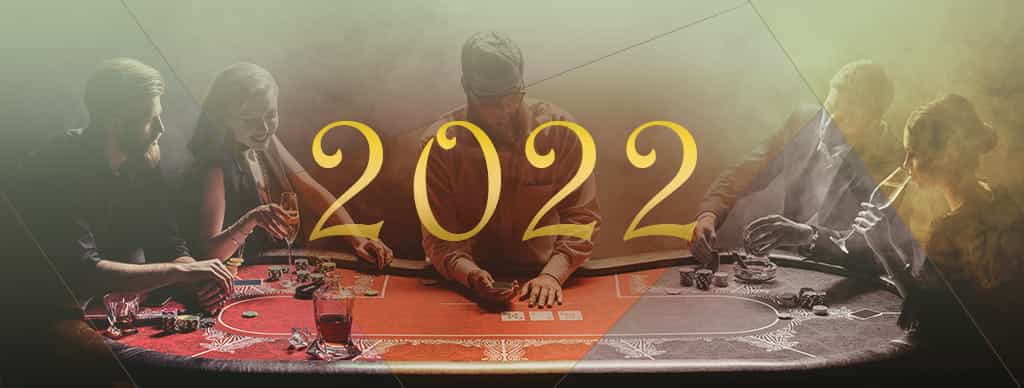 Persone che giocano a poker in un casinò e la scritta 2022.