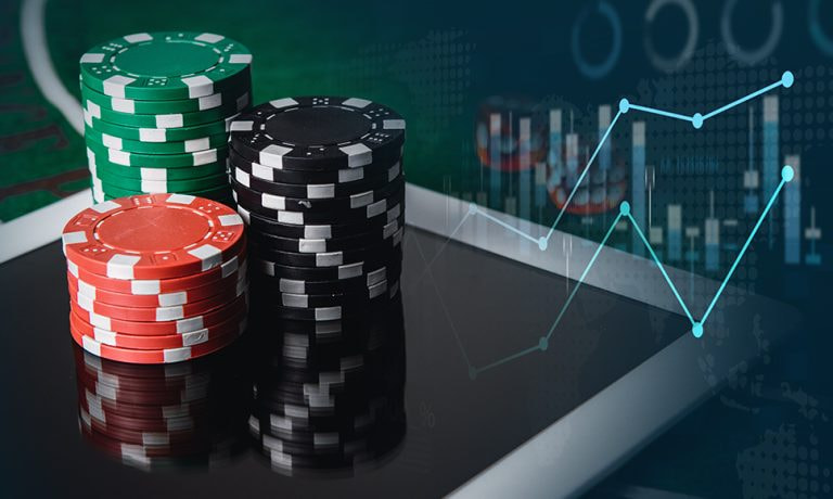 Fiches da poker, tablet e grafici.
