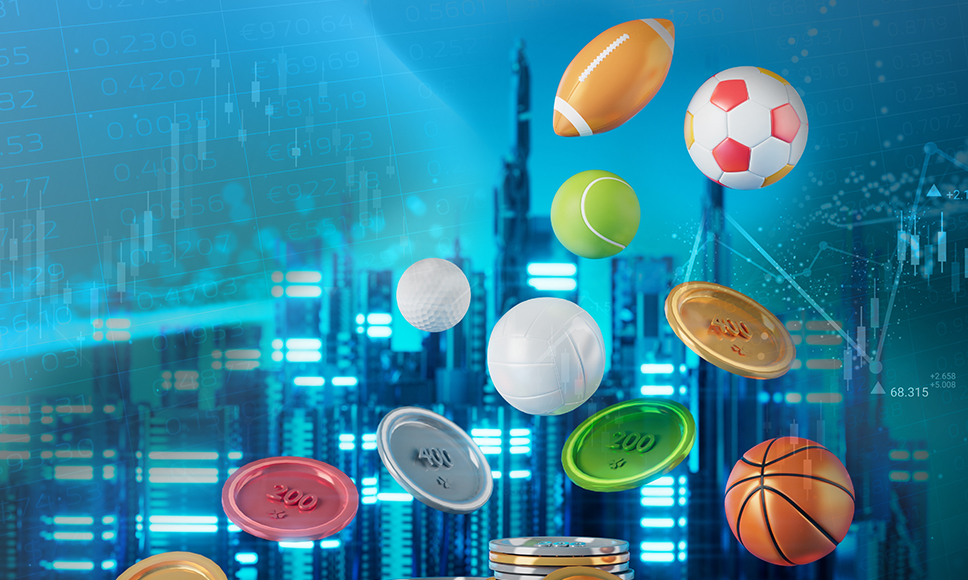 Palloni sportivi e fiches da casinò che fluttuano su uno schermo blu con grafici.  