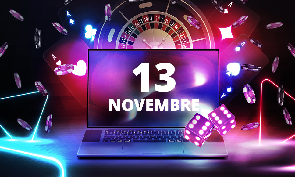 Computer con scritta 13 novembre tra simboli del casinò online: roulette, carte e dadi.